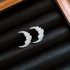 Angled view of the 14K Gold-Plated Sleep Tight Flower Moon Stud Earrings