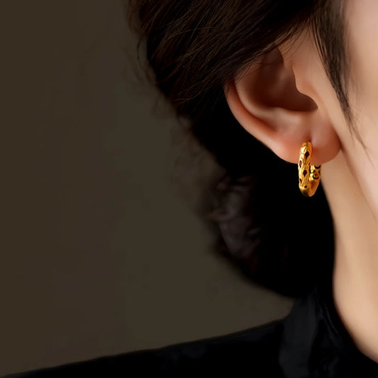 Model showcasing the dangle and style of the 14K Gold-Plated Small Hoop Earrings