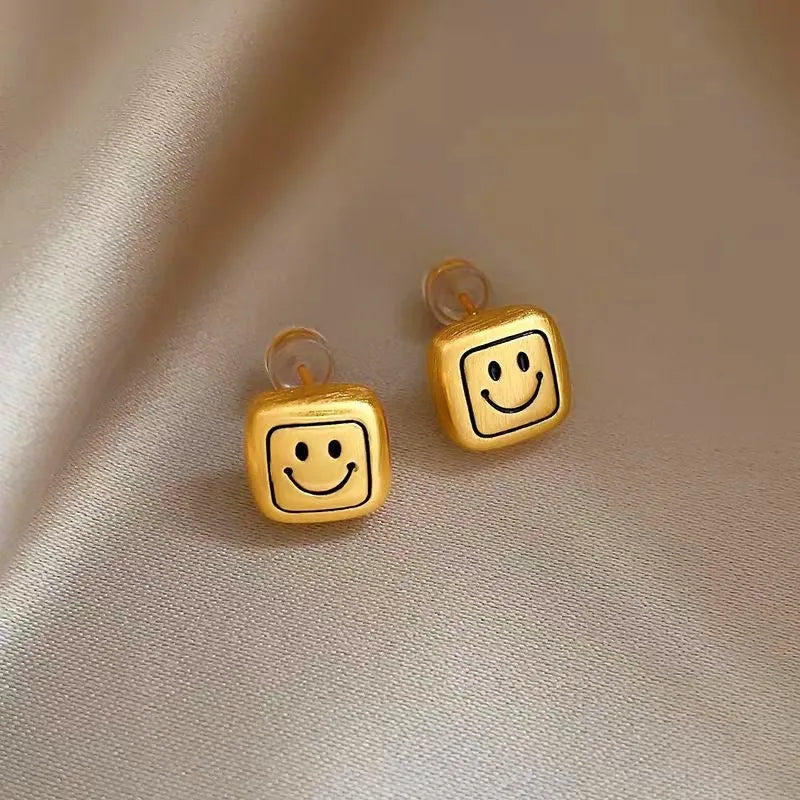 Close-up detail of the sparkling zircons and plating on the Smiley Face Studs