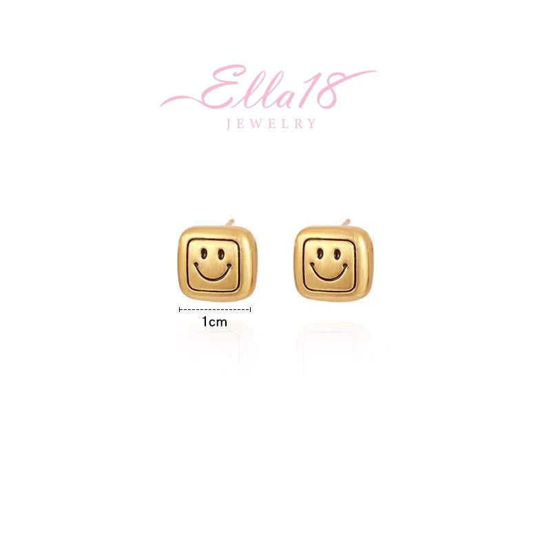 Angled view of the 14K Gold-Plated Smiley Face Stud Earrings