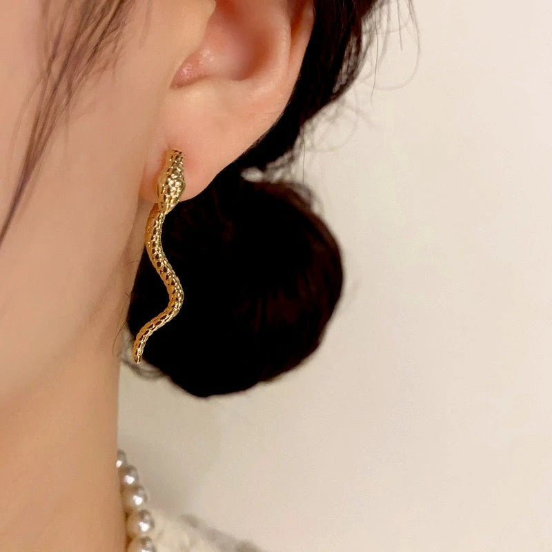 Close-up detail of the sparkling zircons and plating on the Snake Shaped Earrings