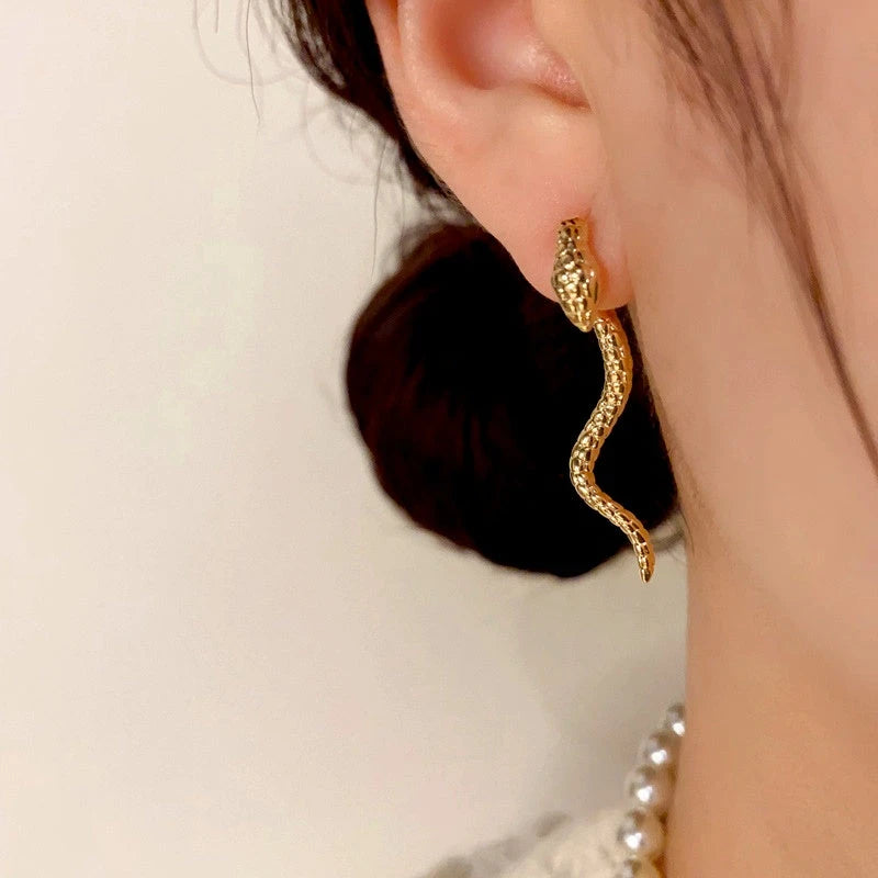 Angled view of the 14K Gold-Plated Snake-Shaped Earrings