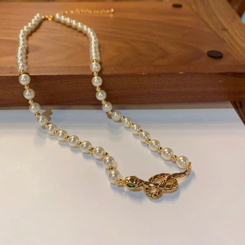 14K Gold-Plated Snake Pearl Necklace worn to showcase its length and pendant detail