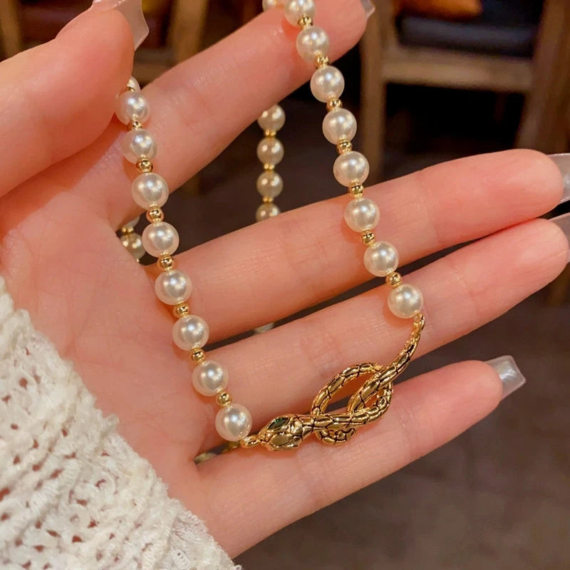 Close-up of the pendant and clasp on the Snake Pearl Necklace