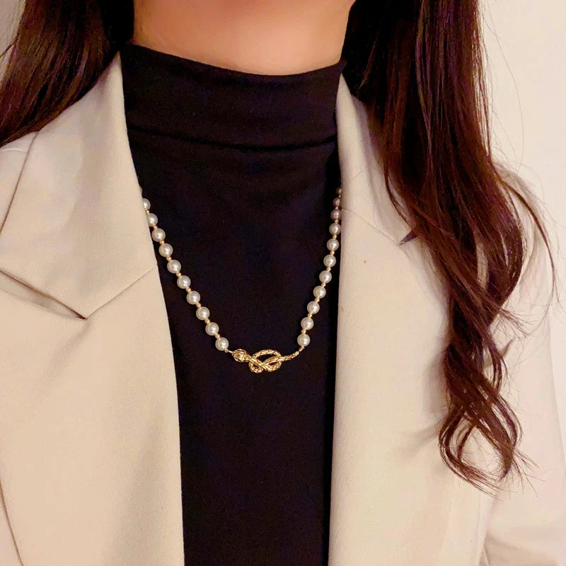 Detailed view of the 14K Gold-Plated Snake Pearl Necklace chain and pendant