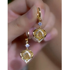 Close-up detail of the sparkling zircons and plating on the Diamond Heart Earrings