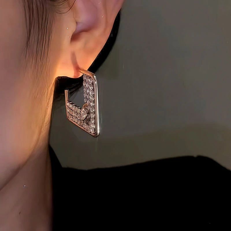 Close-up detail of the sparkling zircons and plating on the Square Diamond Earrings