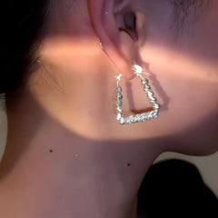 Model showcasing the dangle and style of the 14K Gold-Plated Square Earrings