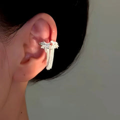 Model showcasing the dangle and style of the 14K Gold-Plated Star Diamond Tassel Ear Clips ( 1 Pair )