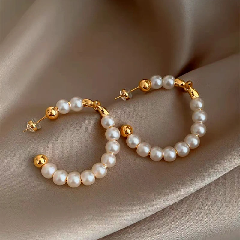 Close-up detail of the sparkling zircons and plating on the Star Pearl Earrings