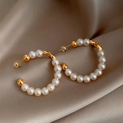Close-up detail of the sparkling zircons and plating on the Star Pearl Earrings