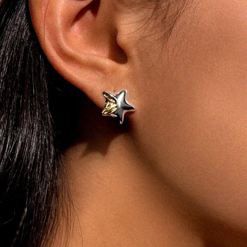 Angled view of the 14K Gold-Plated Star Stud Earrings