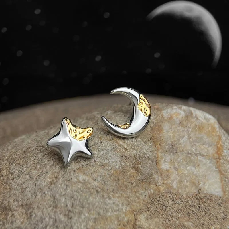 Model showcasing the dangle and style of the 14K Gold-Plated Star Stud Earrings