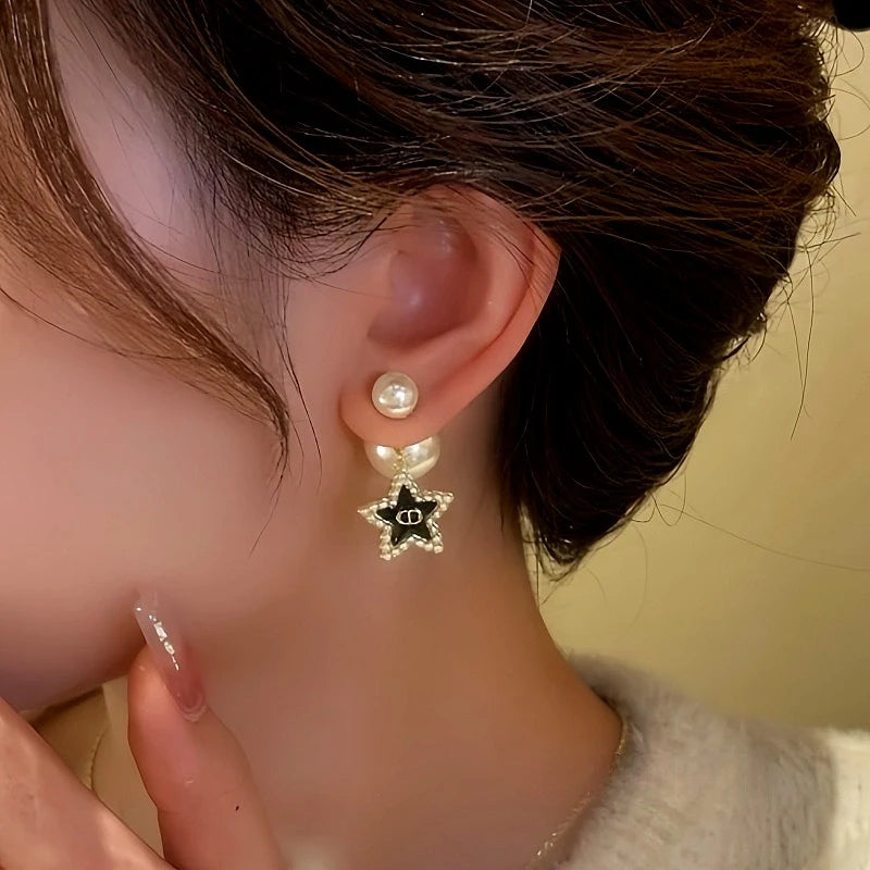 Close-up detail of the sparkling zircons and plating on the Star Tassel Bead Earrings