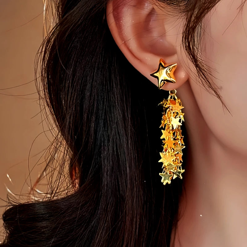 Close-up detail of the sparkling zircons and plating on the Star Tassel Earrings