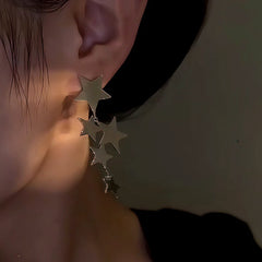 Close-up detail of the sparkling zircons and plating on the Star Tassel Earrings