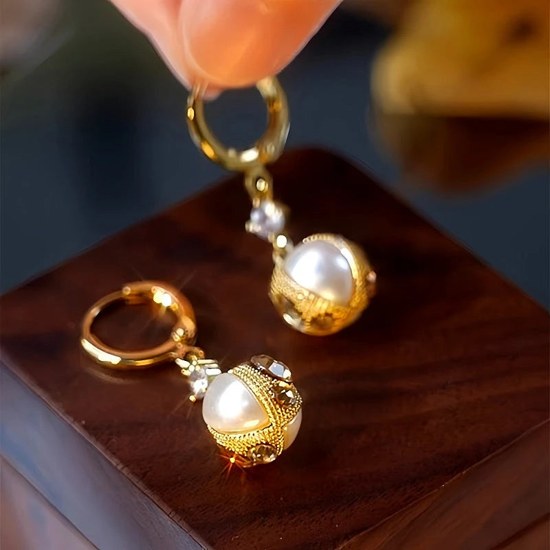 Angled view of the 14K Gold-Plated Stone Pearl Earrings