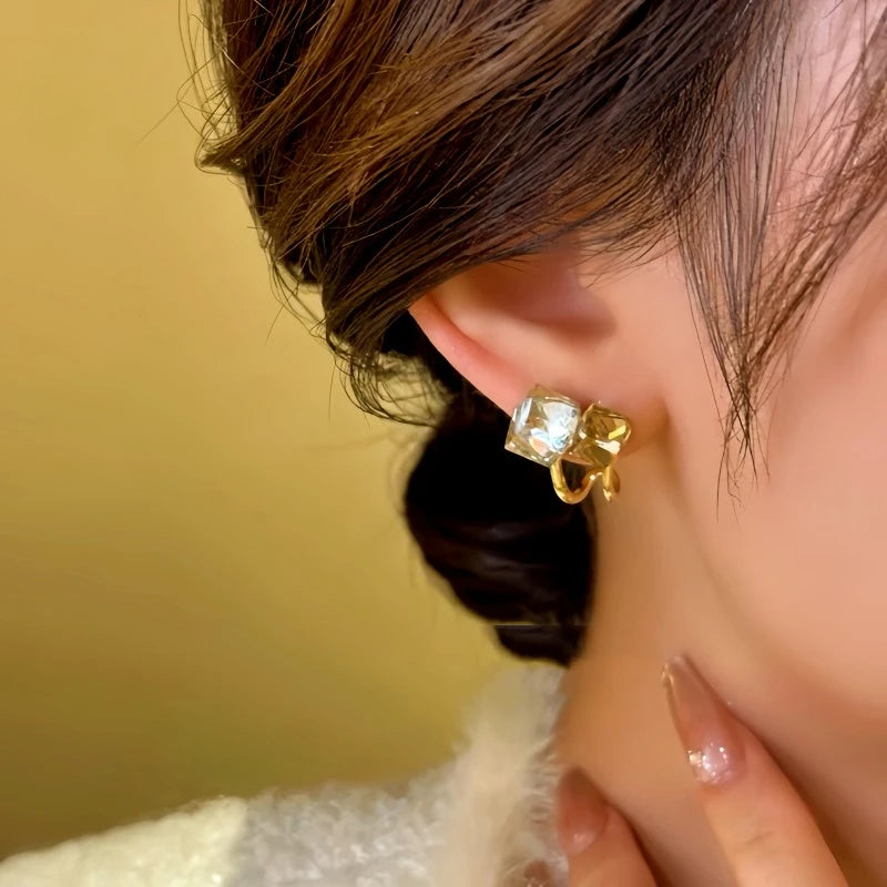 Close-up detail of the sparkling zircons and plating on the Crystal Stitching Earrings