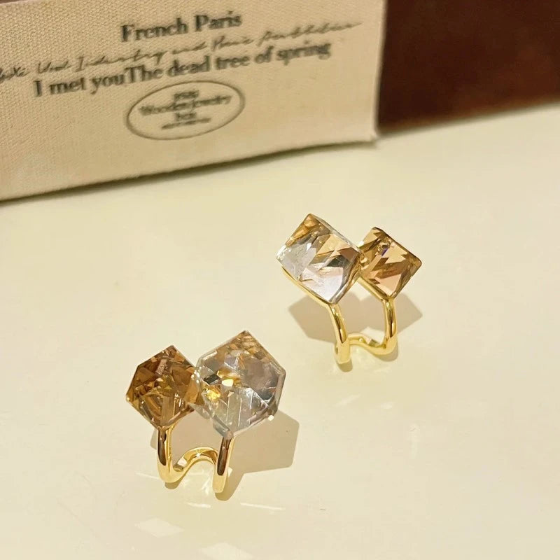 Angled view of the 14K Gold-Plated Sugar Cube Crystal Stitching Earrings
