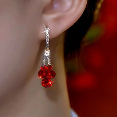 Close-up detail of the sparkling zircons and plating on the Red Crystal Earrings