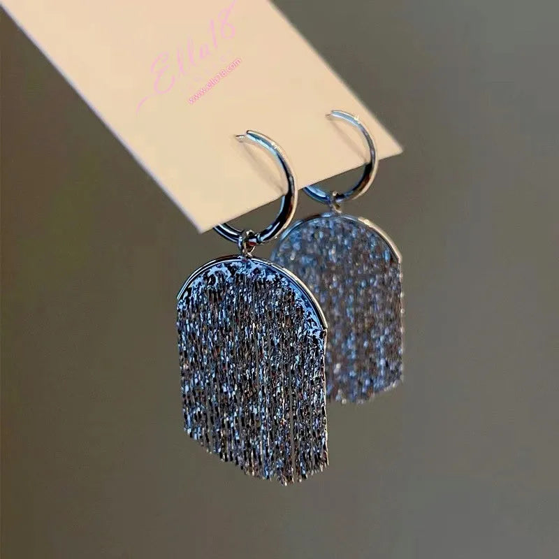 Close-up detail of the sparkling zircons and plating on the Tassel Pendant Earrings