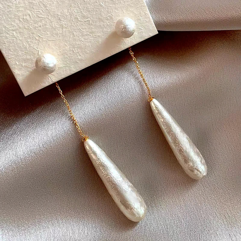Close-up detail of the sparkling zircons and plating on the Textured Pearl Earrings