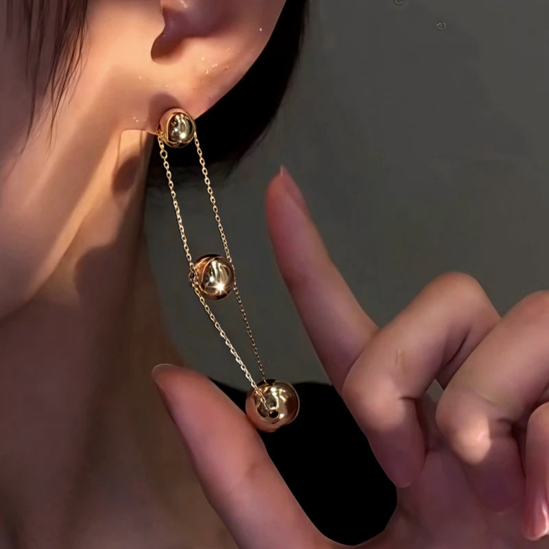 Close-up detail of the sparkling zircons and plating on the Ball Chain Earrings
