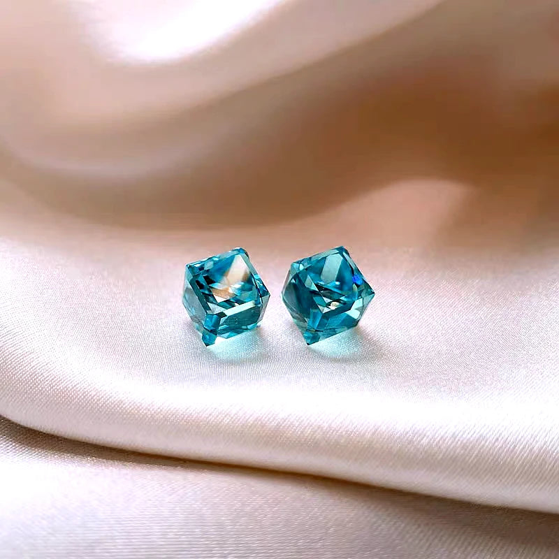 Angled view of the 14K Gold-Plated Three-Dimensional Square Blue Crystal Stud Earrings