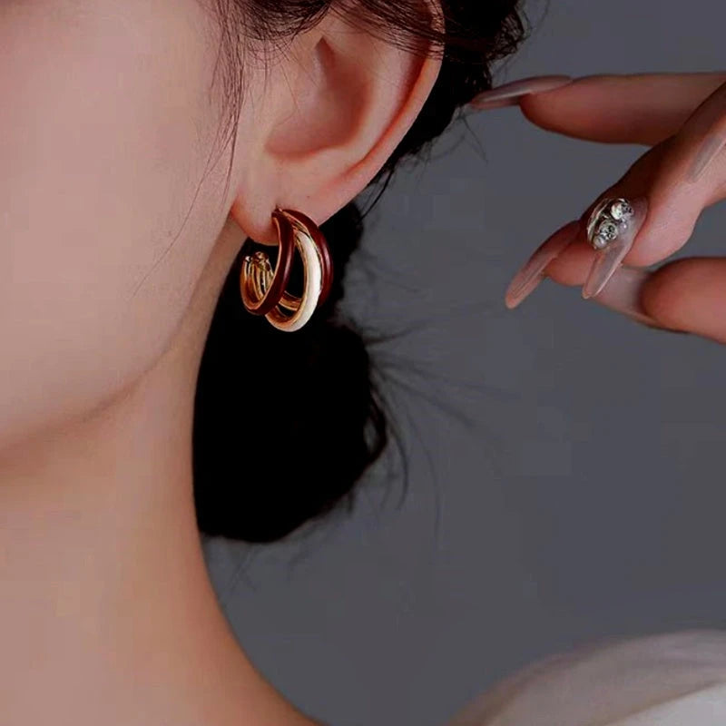 Angled view of the 14K Gold-Plated Three Layer Earrings