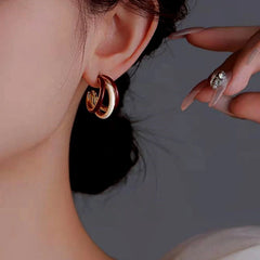 Angled view of the 14K Gold-Plated Three Layer Earrings