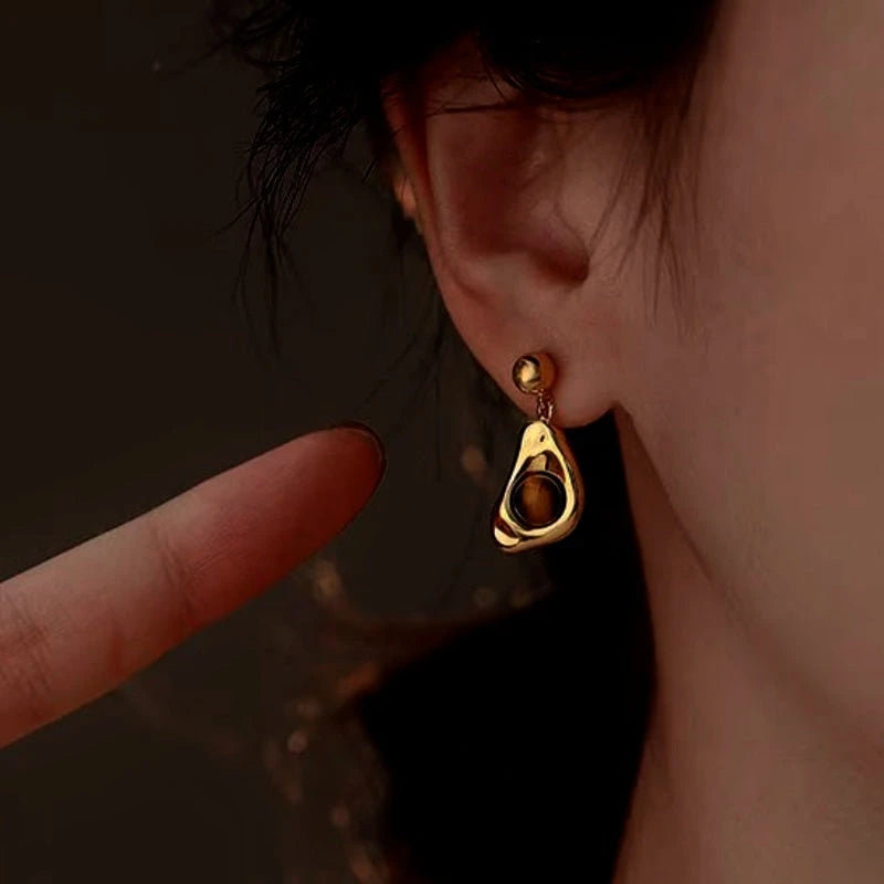 Close-up detail of the sparkling zircons and plating on the Tiger's Eye Earrings