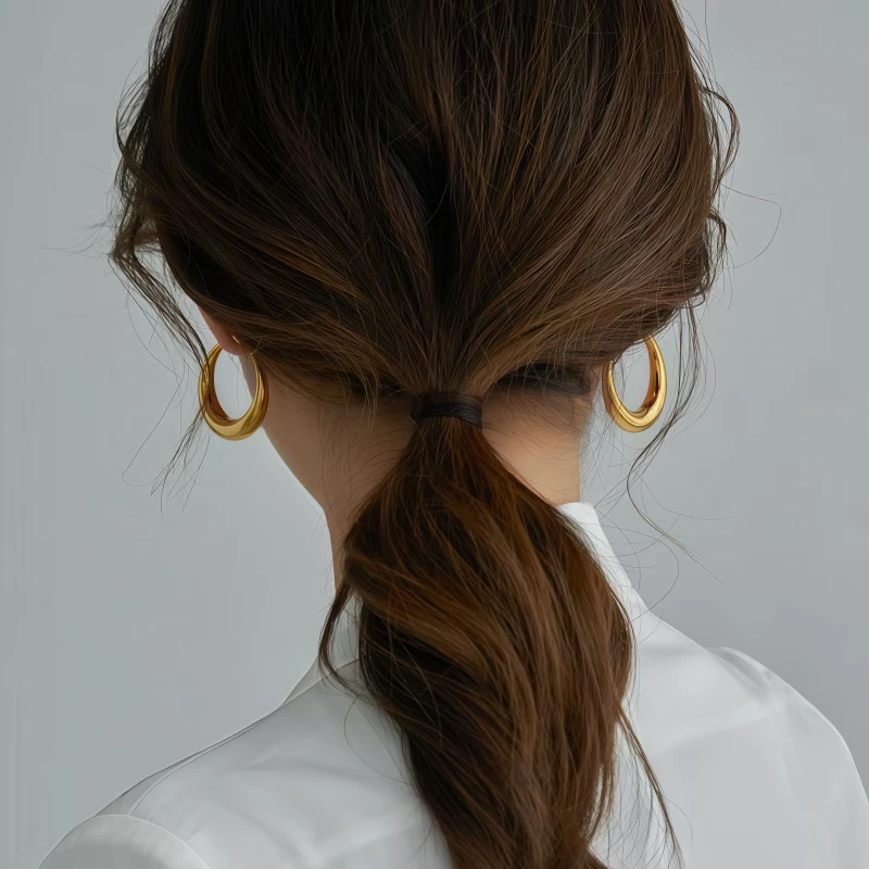Detailed view of the sparkling accents on the C-Shaped Hoop Earrings