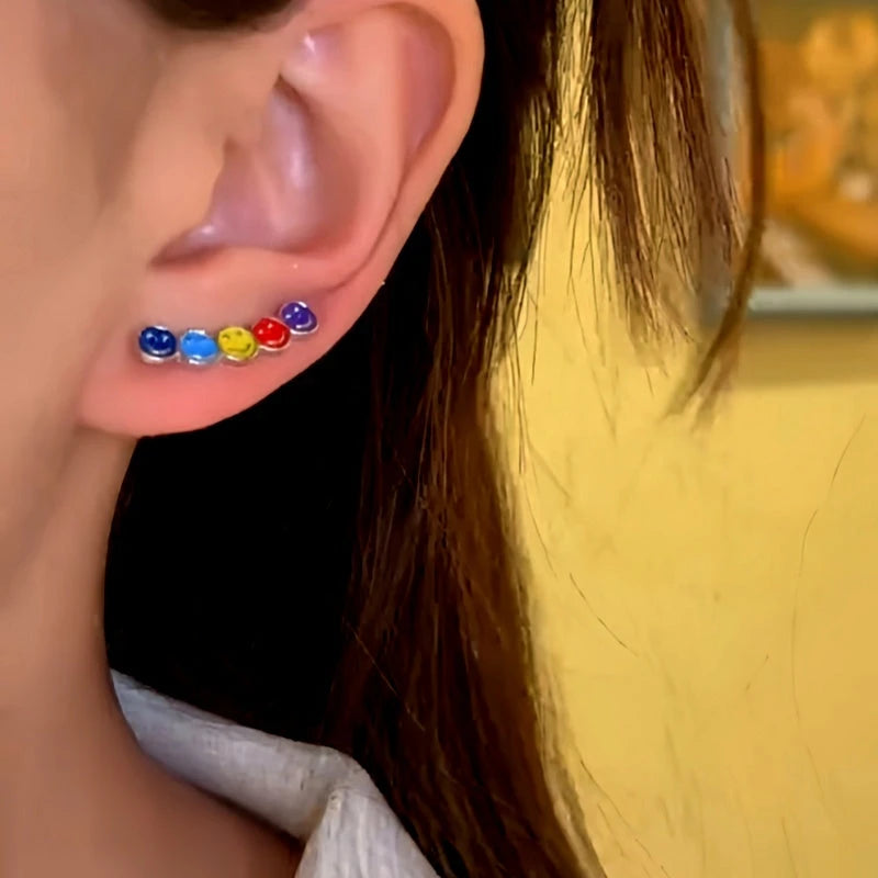 Close-up detail of the sparkling zircons and plating on the Rainbow Smiley Earrings