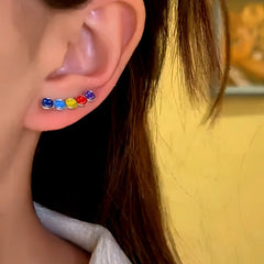 Close-up detail of the sparkling zircons and plating on the Rainbow Smiley Earrings
