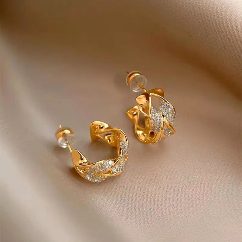 Close-up detail of the sparkling zircons and plating on the Diamond C-Hoop Earrings