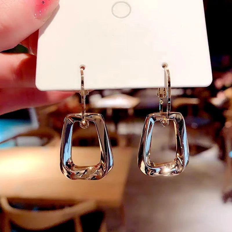 Angled view of the 14K Gold-Plated Twisted Earrings