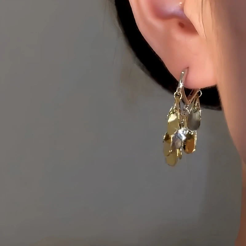 Model showcasing the dangle and style of the 14K Gold-Plated Water Drop Earrings