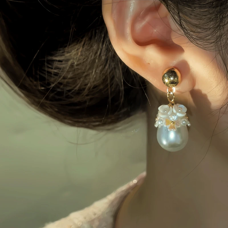 Close-up detail of the sparkling zircons and plating on the Flower Pearl Earrings