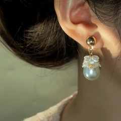 Close-up detail of the sparkling zircons and plating on the Flower Pearl Earrings
