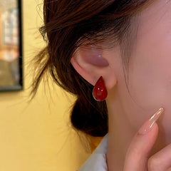 Close-up detail of the sparkling zircons and plating on the Gold Teardrop Studs