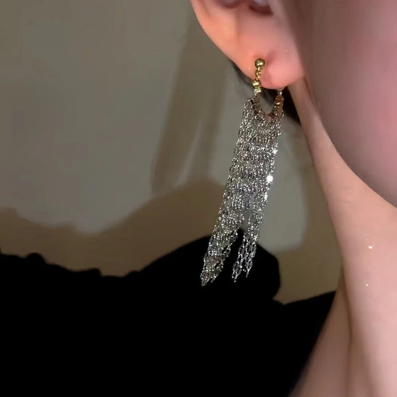 Close-up detail of the sparkling zircons and plating on the Waterfall Tassel Earrings