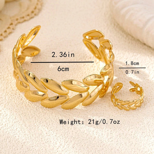 Model wearing the 14K Gold-Plated Wheat Bracelet And Ring Set to highlight its design on the wrist