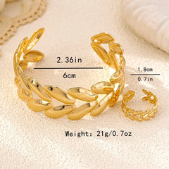 Model wearing the 14K Gold-Plated Wheat Bracelet And Ring Set to highlight its design on the wrist