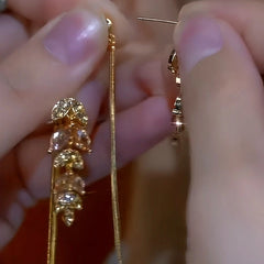 Close-up detail of the sparkling zircons and plating on the Wheat Tassel Earrings
