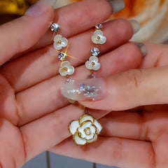 Detailed view of the 14K Gold-Plated White Camellia Flower Necklace chain and pendant