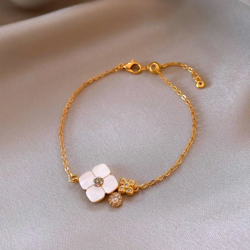 Full view of the elegant 14K Gold-Plated White Mother-Of-Pearl Four-Leaf Clover Bracelet