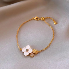 Full view of the elegant 14K Gold-Plated White Mother-Of-Pearl Four-Leaf Clover Bracelet