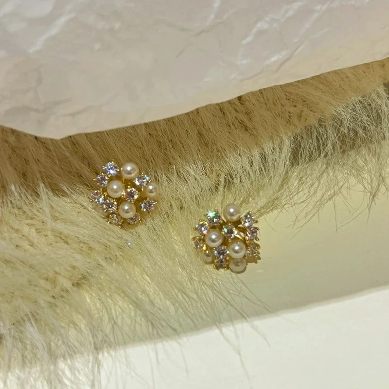 Angled view of the 14K Gold-Plated Wind Bead Earrings