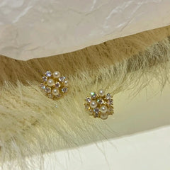 Angled view of the 14K Gold-Plated Wind Bead Earrings