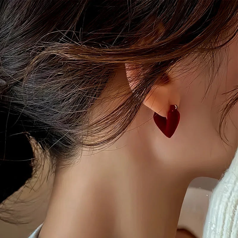 Angled view of the 14K Gold-Plated Wine Red Velvet Flocking Heart Earrings